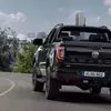Прев'ю зображення Volkswagen Amarok Dark Label на дорозі