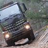 Mercedes-Benz Arocs truck in camouflage.