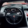 Thumbnail of front and side view of Porsche Carrera GT in Guards Red
