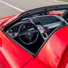 Thumbnail of side mirror view of Porsche Carrera GT in Guards Red