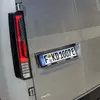 Миниатюра Kia PV5 WAV на парковке