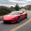 Попереднє зображення Tesla Roadster з відкритими дверима