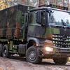 Mercedes-Benz Arocs truck with military equipment.