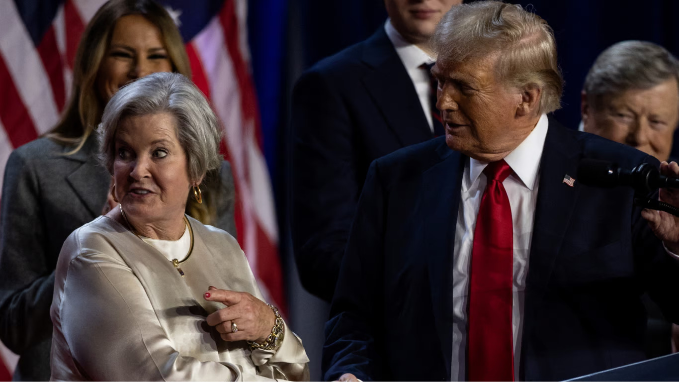 Donald Trump shakes hands with his senior adviser Susie Wiles