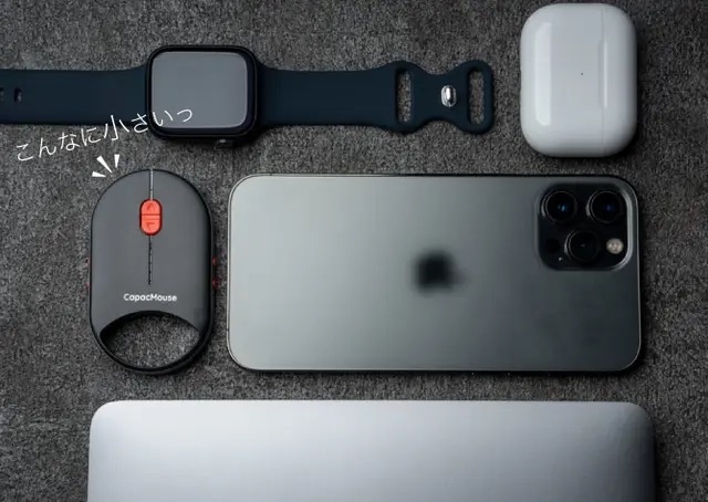 A comparison photo of the CapacMouse Pro's dimensions