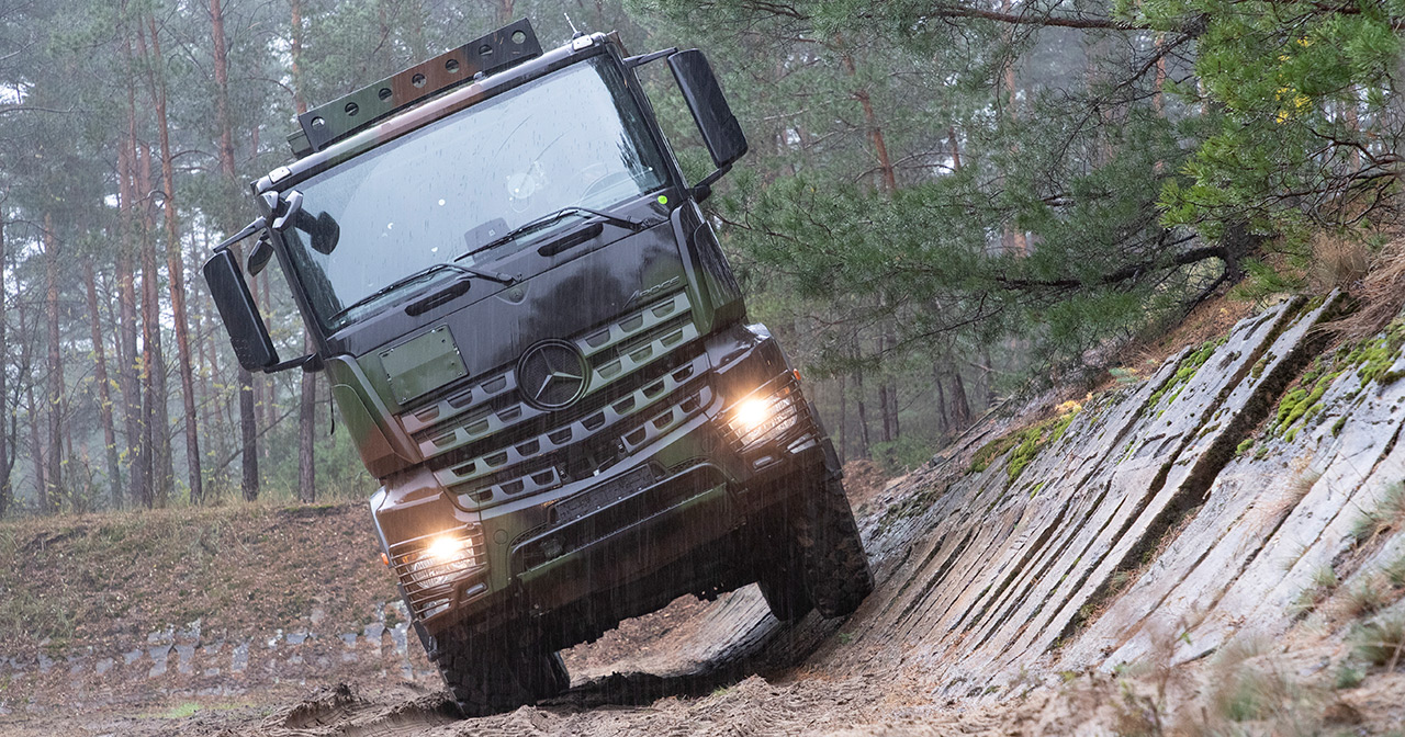 Mercedes-Benz Arocs truck in camouflage.