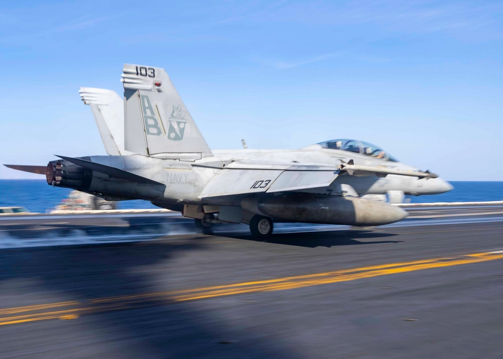 An F/A-18F Super Hornet fighter jet takes off from the USS Harry S. Truman aircraft carrier