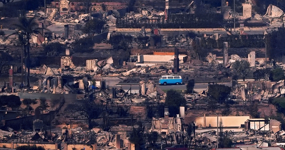 Volkswagen T2 among the burnt-out houses
