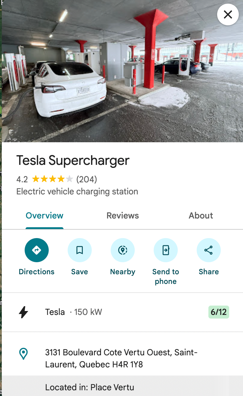 A person looks at Google Maps with Tesla Supercharger data