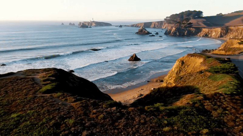 Aerial view of a rocky cliff above the beach