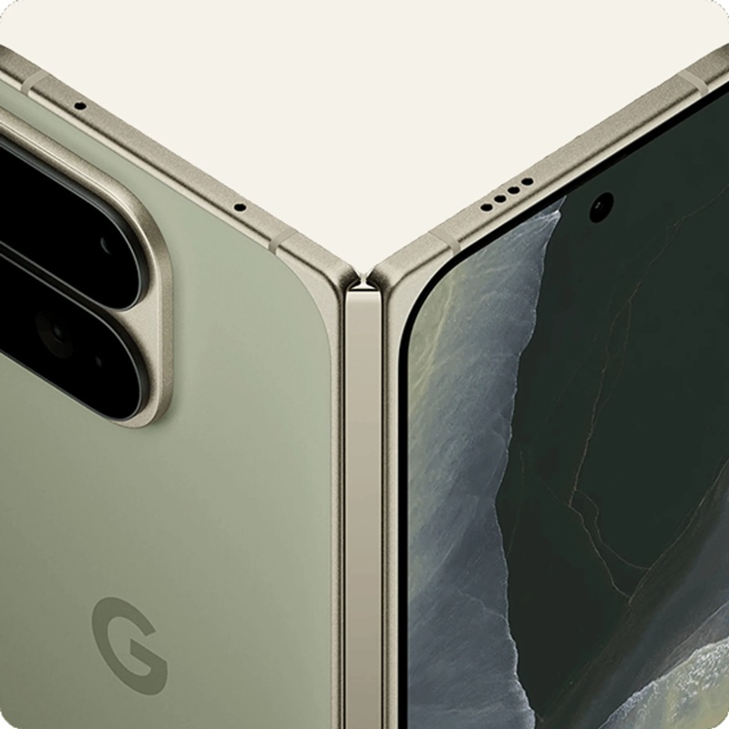 The redesigned camera block on the Pixel 11 Pro Fold in Pine, with the telephoto relocated to the upper-right corner.