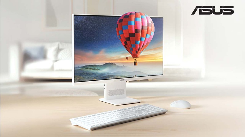 ASUS VM441 all-in-one PC in matte warm white, showing the slim profile and minimal bezels of the 23.8-inch touchscreen.