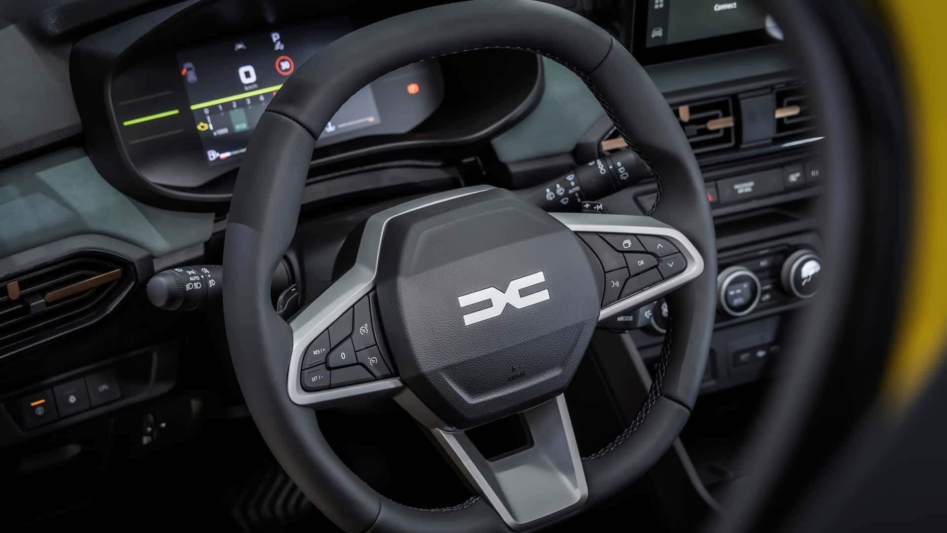 Салон с функциональными деталями Dacia Sandero Stepway Hybrid 2026