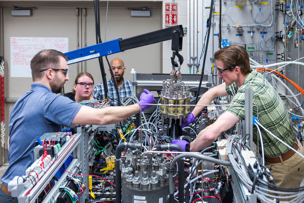 Engineers configure subsystems of the regenerative fuel cell test rig at NASA Glenn Research Center. Photo: NASA / Jef Janis