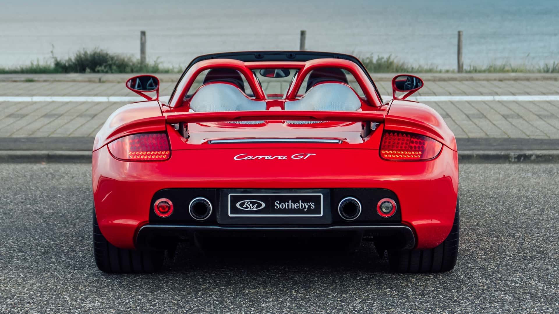 Close-up shot of Porsche Carrera GT in Guards Red wheel