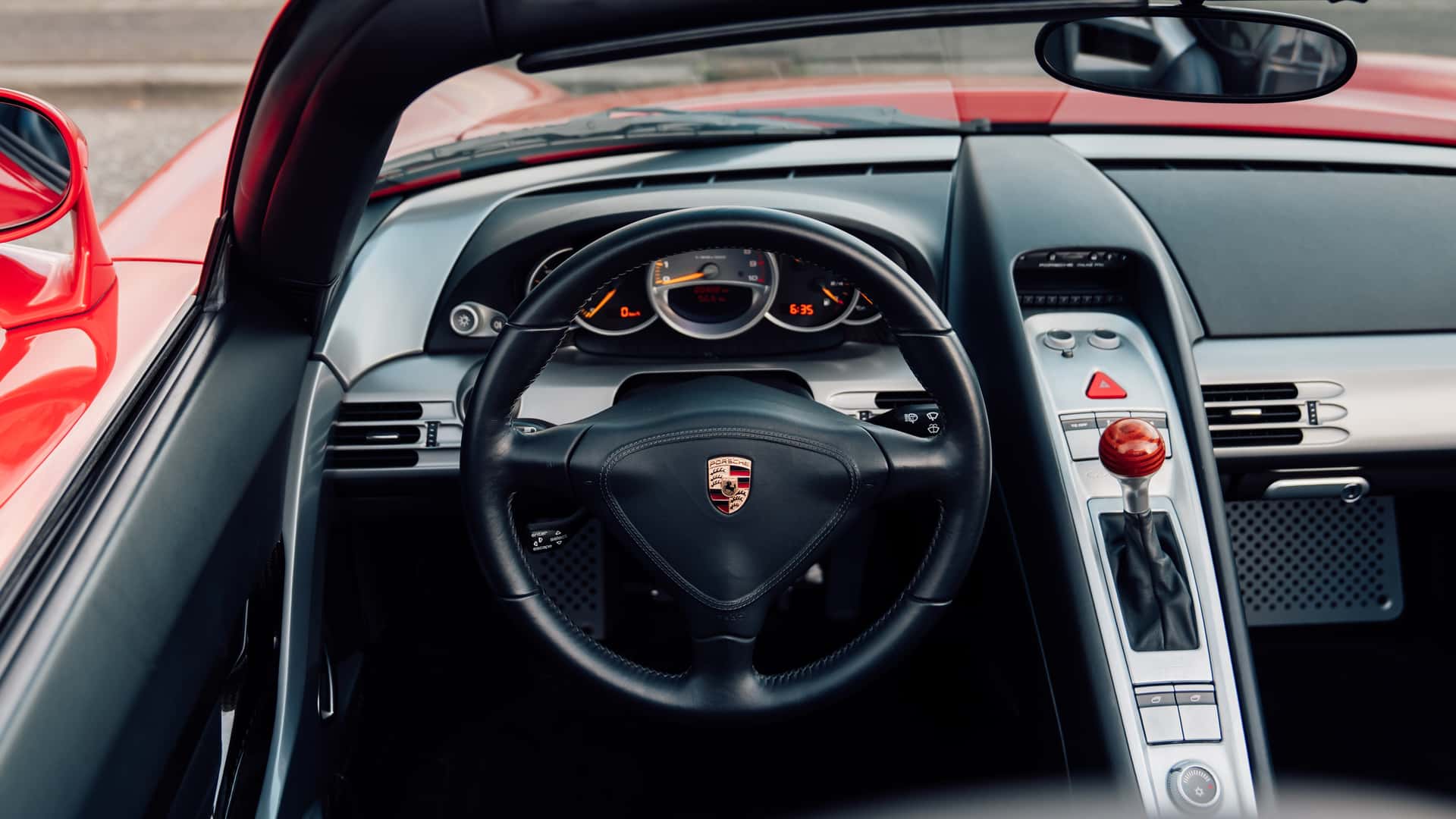 Front and side view of Porsche Carrera GT in Guards Red