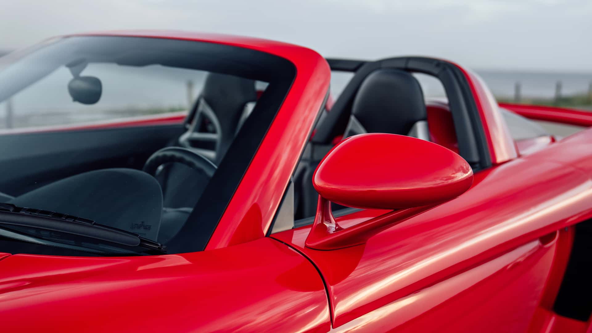 Side panel detail of Porsche Carrera GT in Guards Red