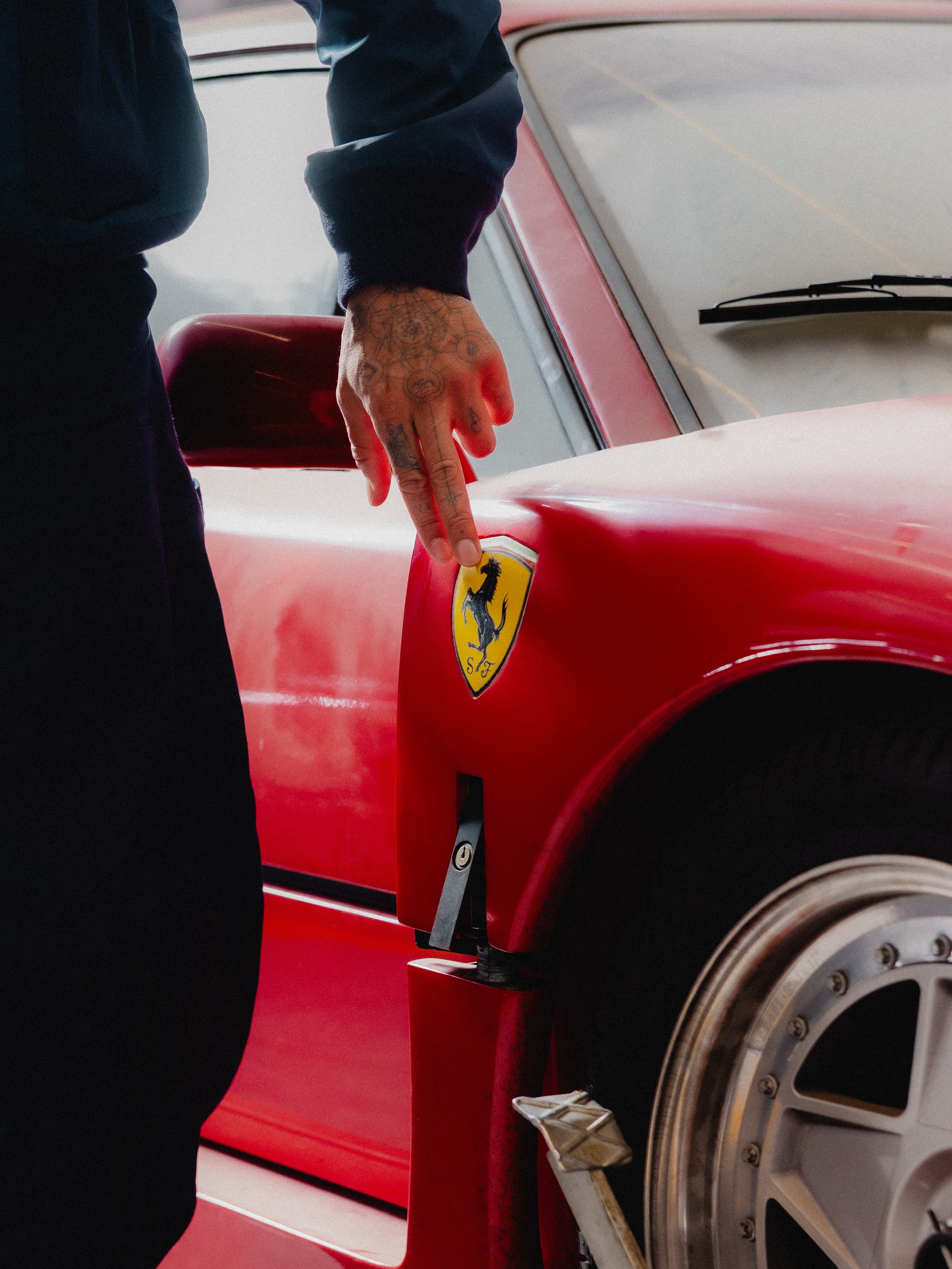 Front side view of Ferrari F40 in garage