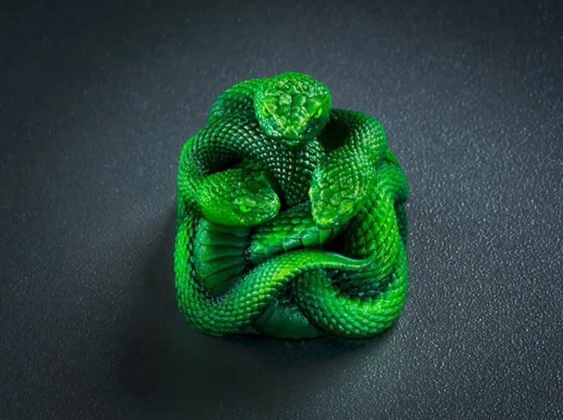 The Razer Artisan Keycap – Triple-Headed Snake Edition, hand-cast in resin and hand-painted.